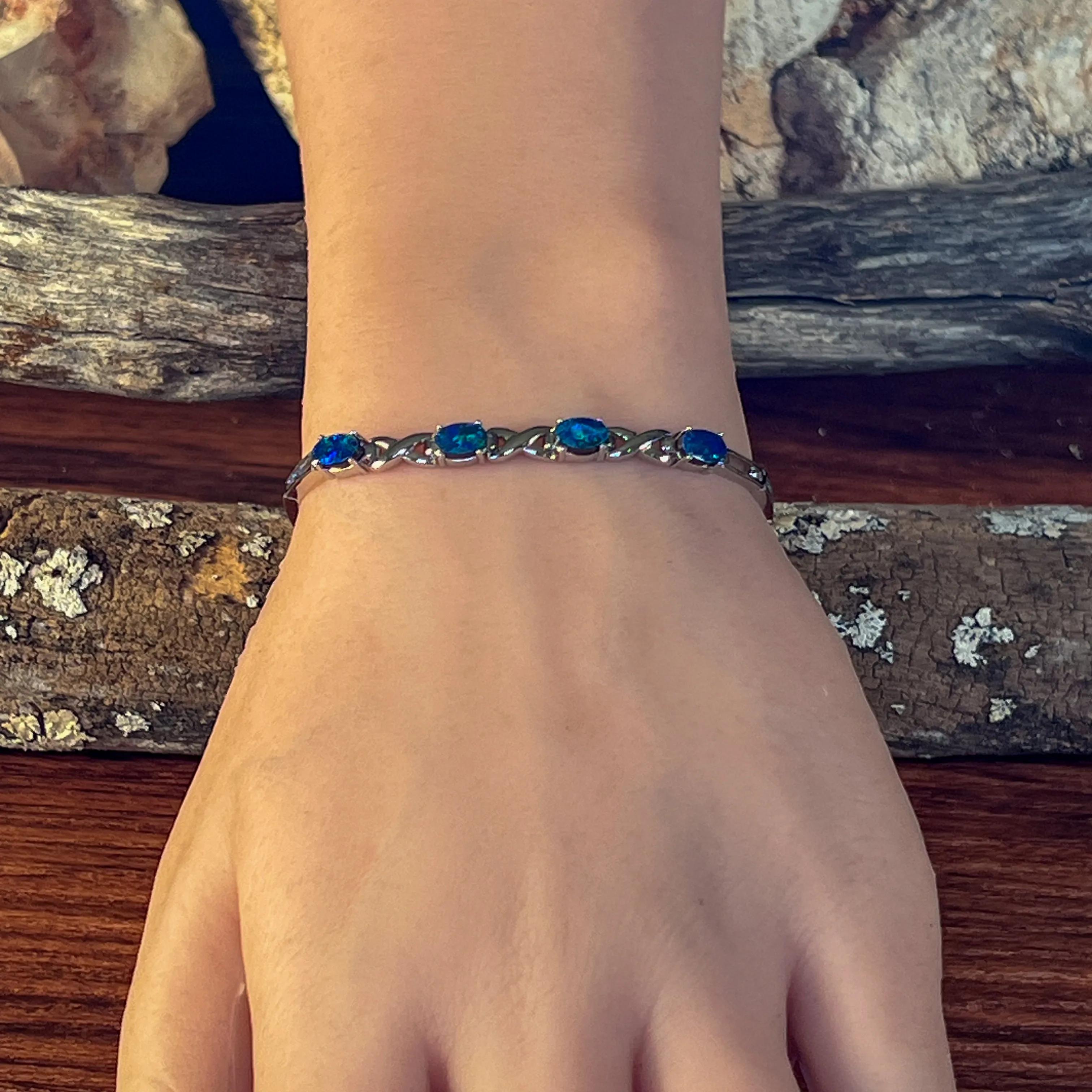 Sterling Silver Opal doublet 6x4mm bracelet claw set